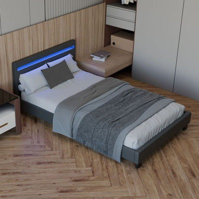 Moderná sivá čalúnená posteľ 90x200 s LED a roštom.